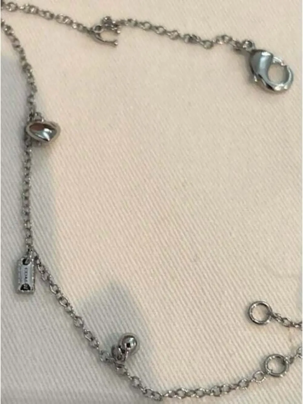 Coach Silver Tone Charm Bracelet with Heart and Logo Charms